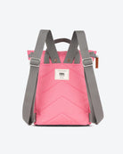 Pink backpack with gray straps on a white background
