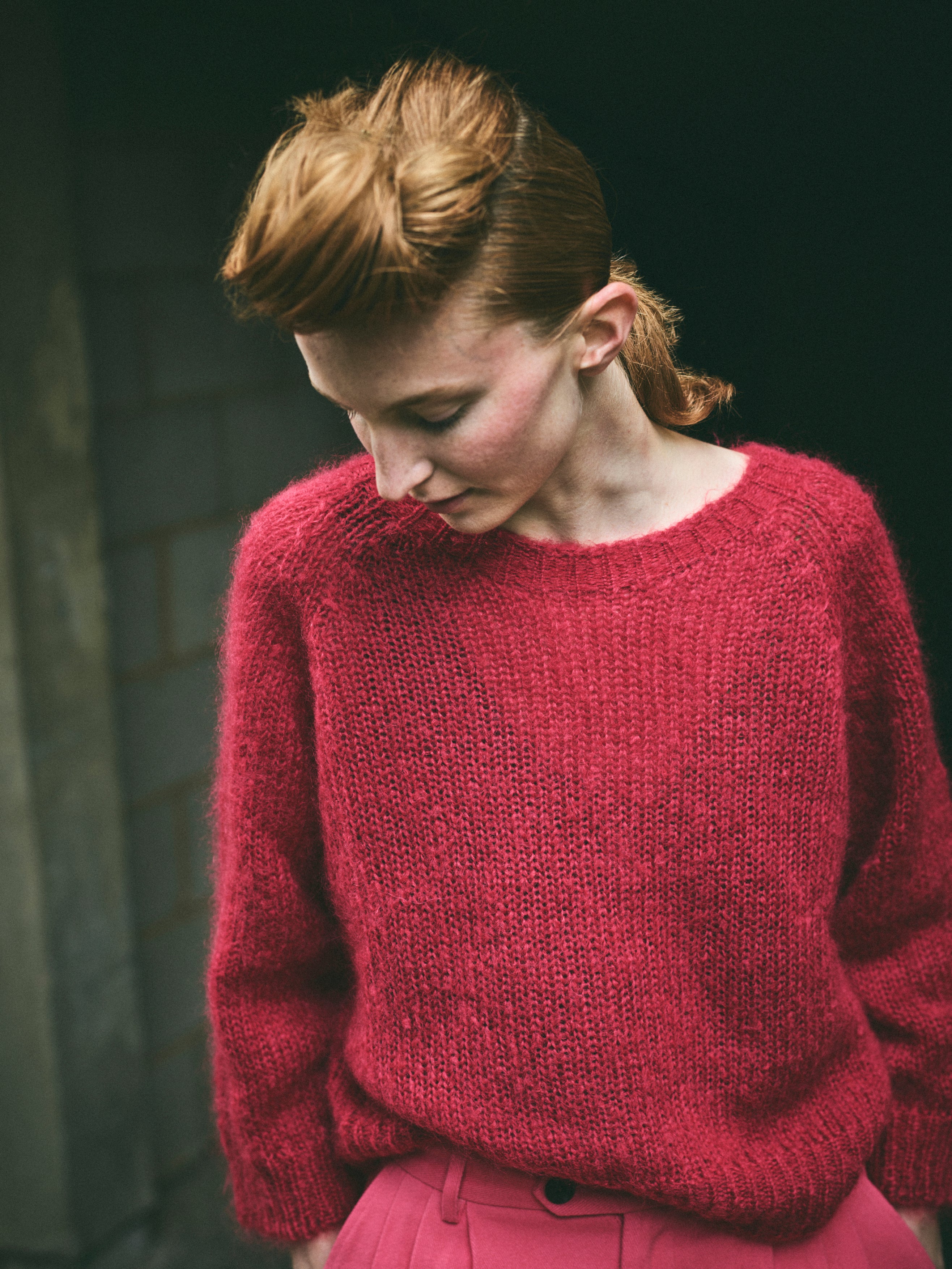 A cropped, bracelet sleeve, round neck red mohair jumper.