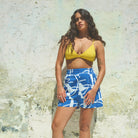 A pair of blue and white paint splash patterned holiday shorts with an elasticated waist and side pockets.