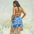 A pair of blue and white paint splash patterned holiday shorts with an elasticated waist and side pockets.