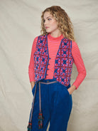 A long-sleeved pink striped organic cotton roll neck t-shirt.