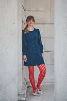 woman in navy corduroy short dress