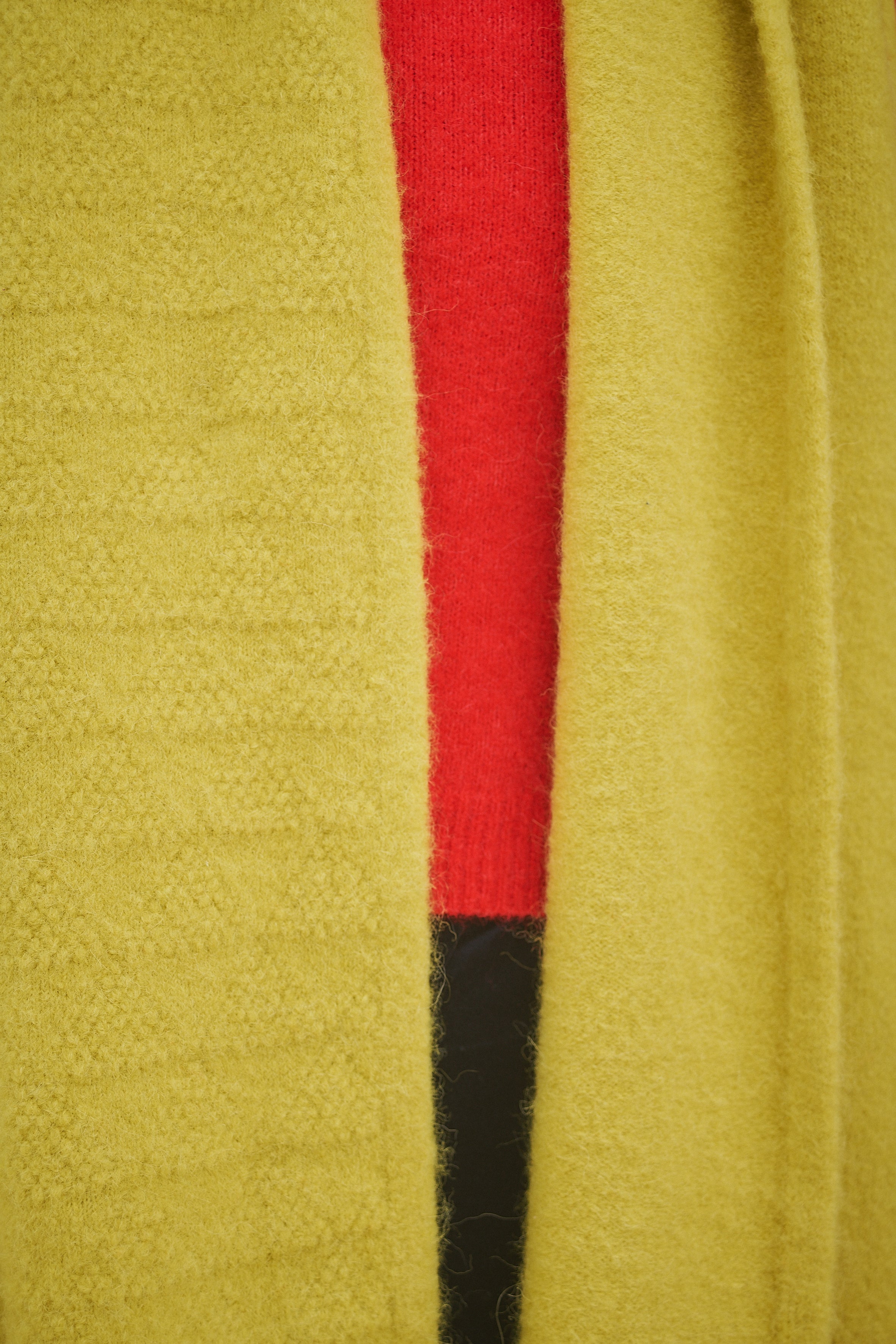 Person Wearing Yellow Scarf and red jumper 