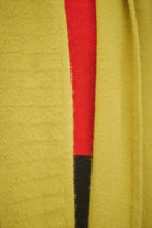 Person Wearing Yellow Scarf and red jumper 