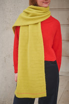 Person Wearing Yellow Scarf and red jumper 