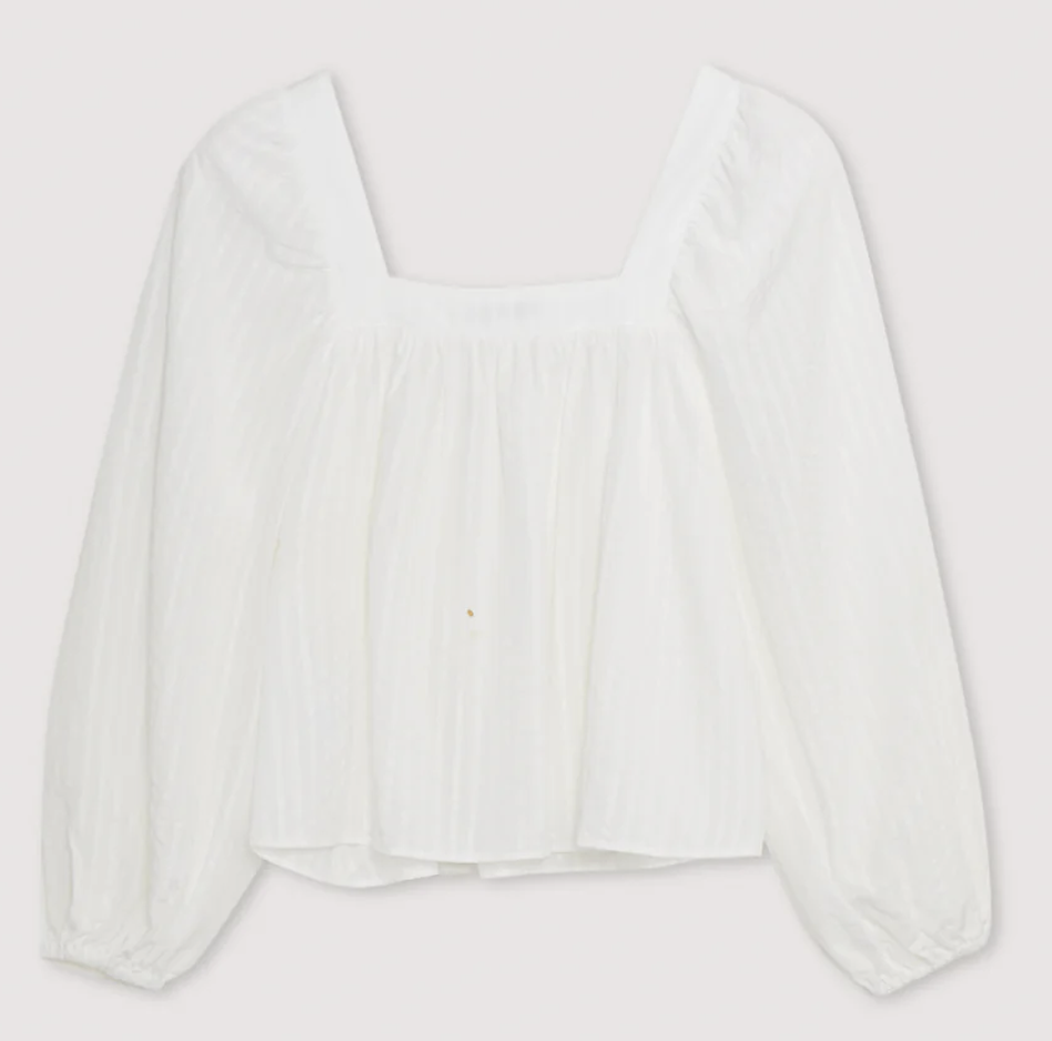 A white Tencel blouse with a square neckline, long sleeves, and elastic cuffs on a plain background.