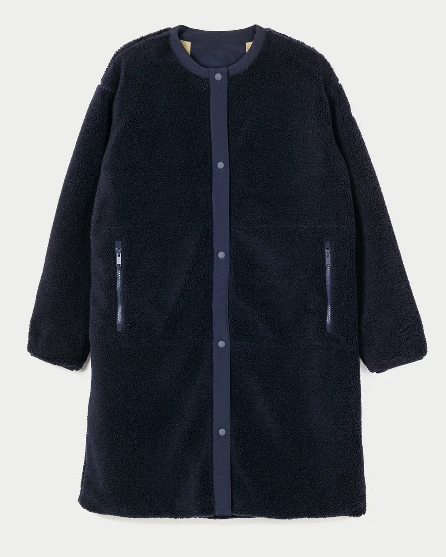A dark navy blue sherpa fleece coat with a button-up front, ribbed collar, and zippered hand pockets, shown against a light gray background.