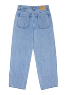 A pair of blue carpenter style jeans with embroidery on the front legs and a center front seam, displayed against a white background.