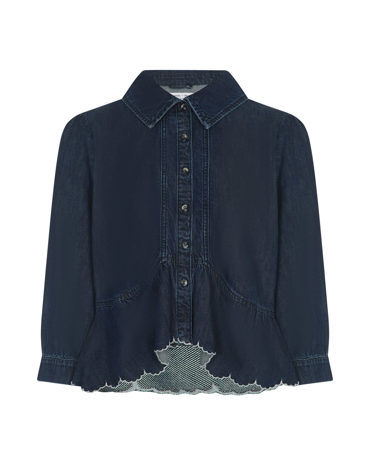 A dark navy blue denim shirt jacket with a pointed collar, button-up front, and a distinctive raw, frayed hem detail showing a lighter gray lining.