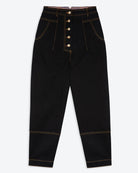 A pair of black cotton drill trousers with a high waist, wide beltband, and 5 button fly front. Features include slanted side pockets and raw stitching.