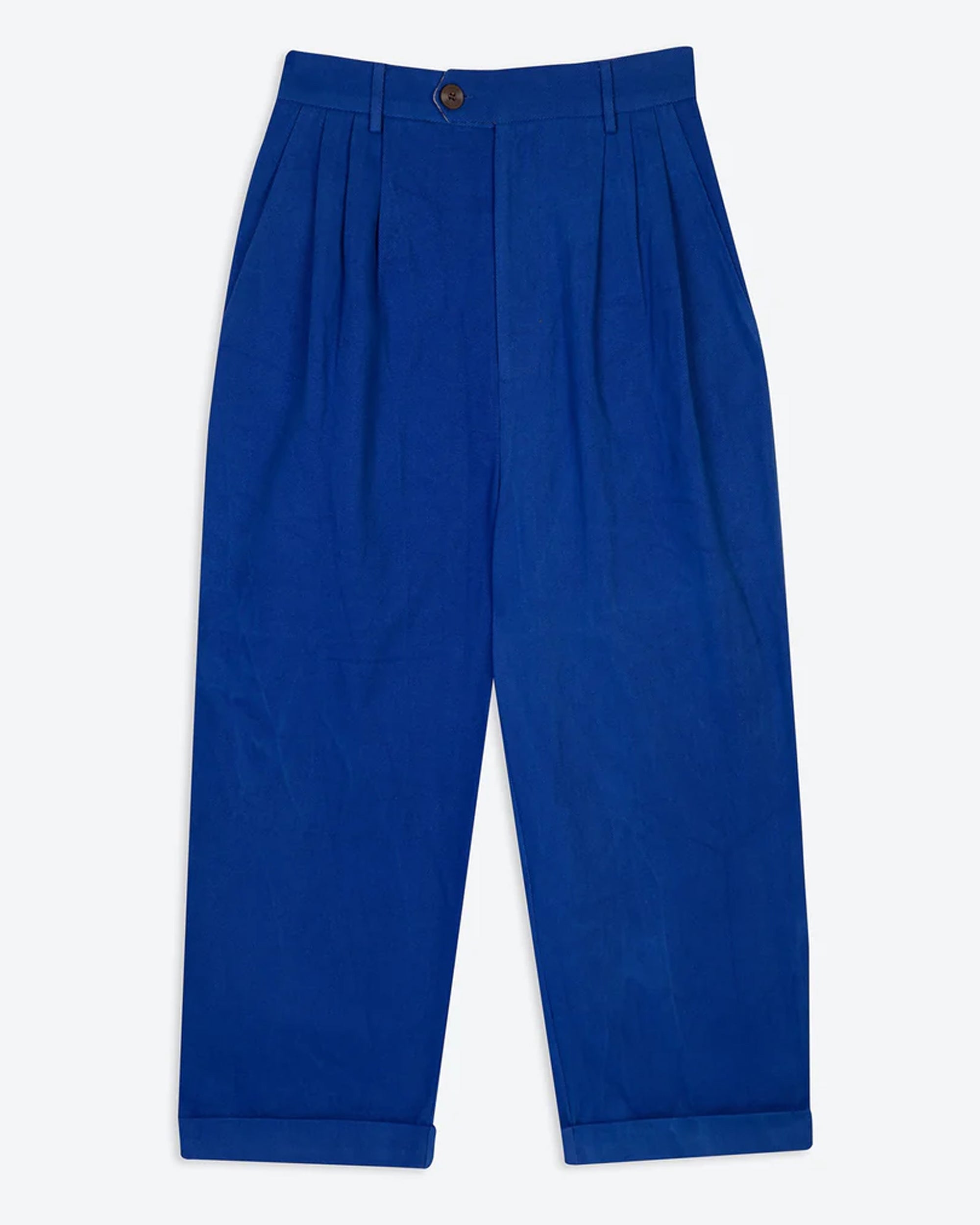A pair of cobalt blue pleat front trousers with a tab front opening and back jet pockets, made from a twill fabric.