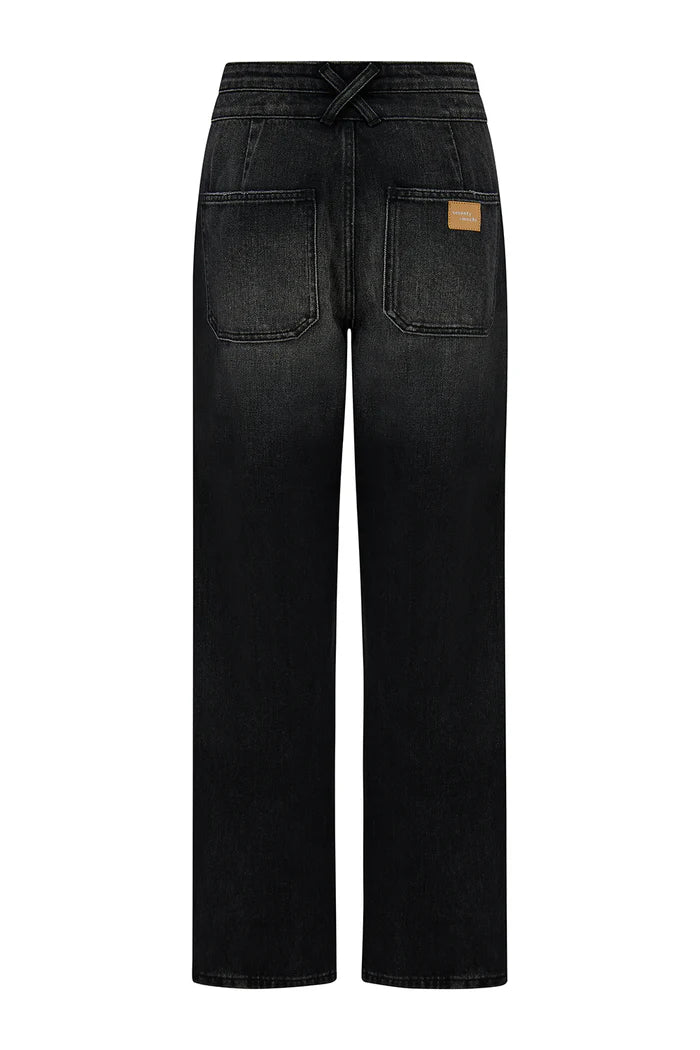 Black jeans with a visible brand label on a white background