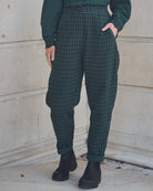 Person wearing Lowie Green Check Trousers