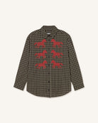 A long-sleeve button-up shirt in a brown and black checkered pattern, featuring six red embroidered horse motifs on the front, displayed against a light cream background.