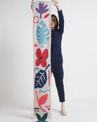 Person holding bright coloured scarf