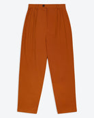 A pair of orange wide leg trousers with pleats and a fixed turn-up hem, made from cotton drill fabric.
