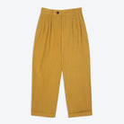 A pair of mustard yellow, pleat-front trousers with a tab front opening and back jet pockets.