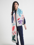 Person holding bright coloured scarf