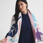 Person holding bright coloured scarf